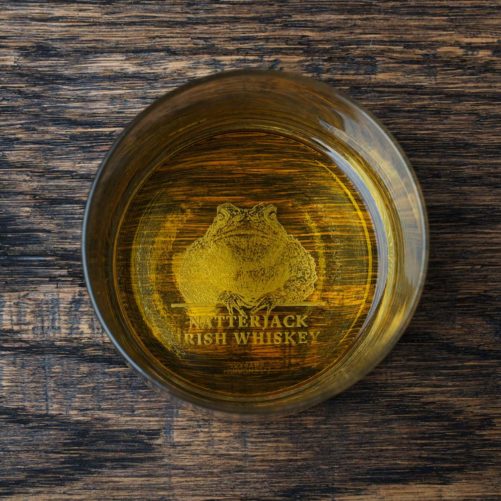 Natterjack Irish Whiskey Glass on Wooden Table
